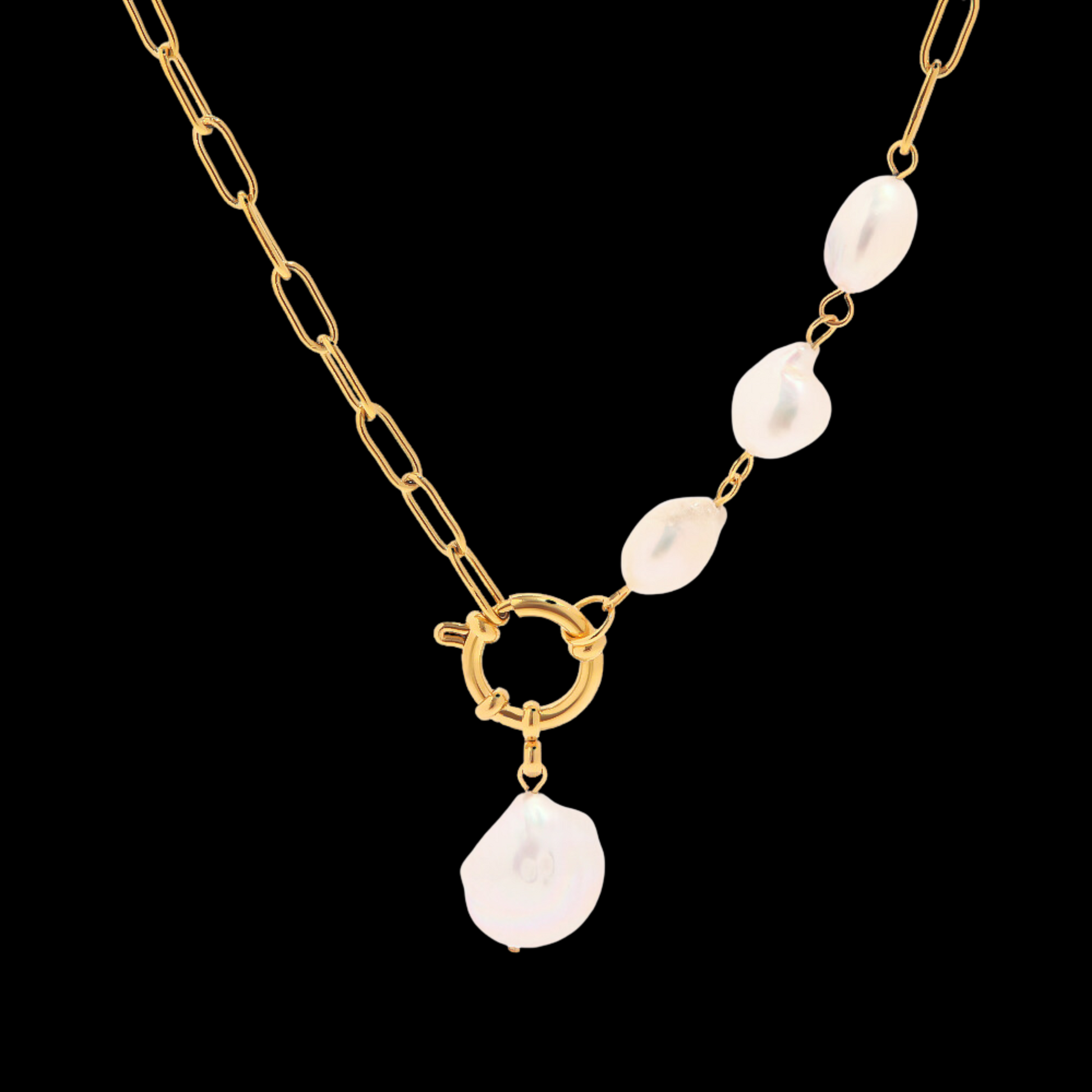 Gold necklace with white pearls on a black background